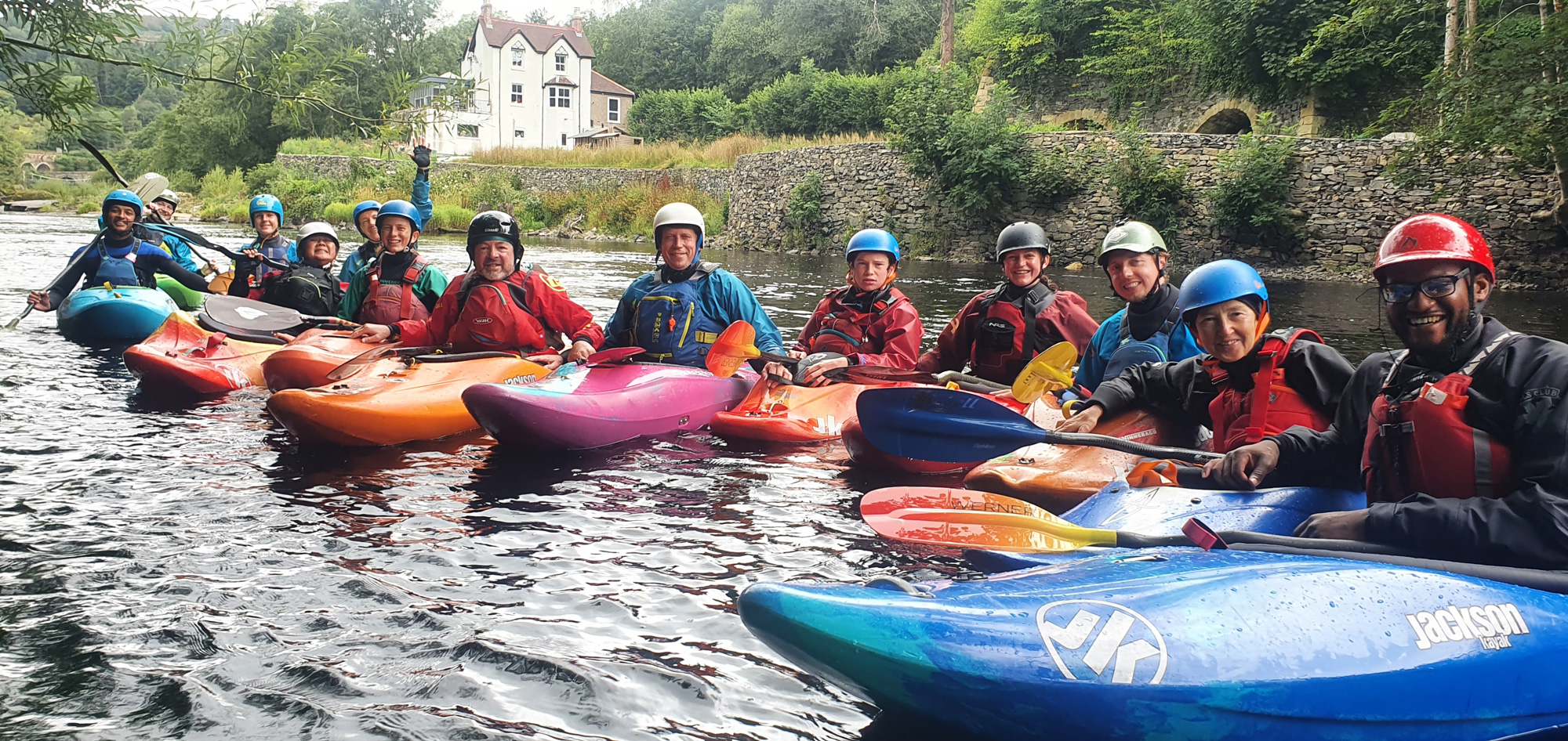 Adult Canoe Club group on the river
