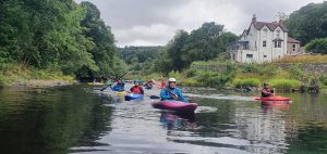 Adults learn to kayak on a weekend trip