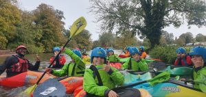Learning to kayak on a kids school holiday camp